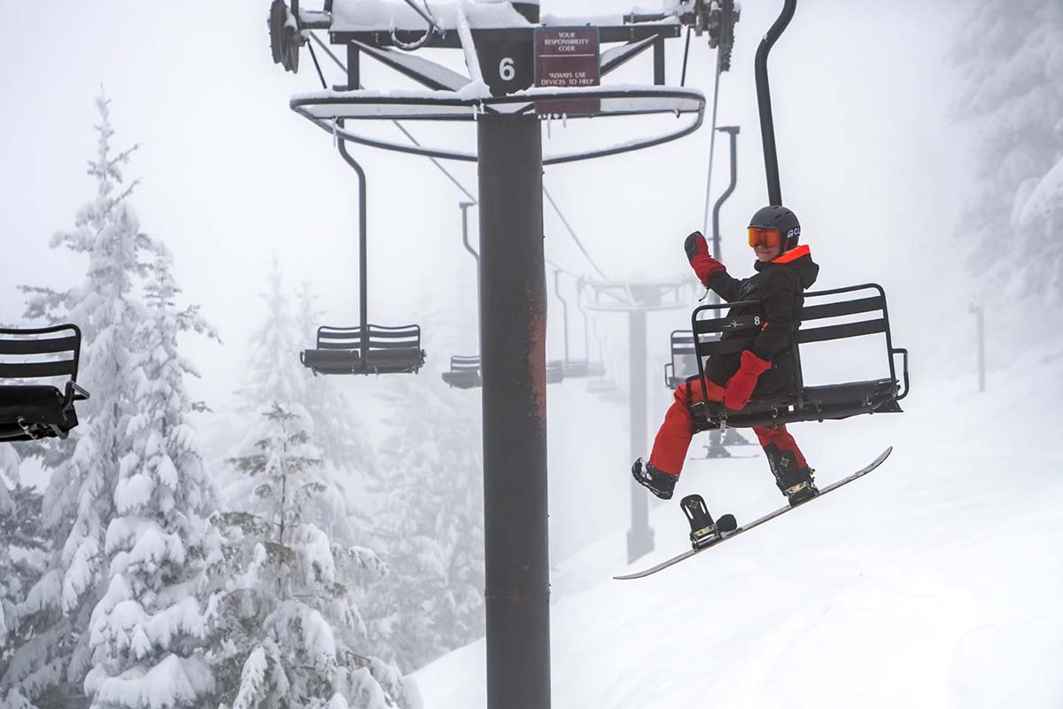 Riding a chairlift in insulated snowboard jacket